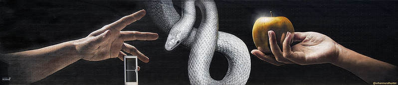 Composite image of a reaching hand, a snake and a hand holding an apple