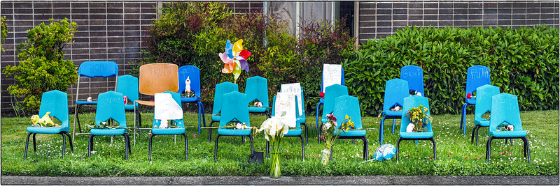 Twenty-one classroom chairs as a memorial to the victims of the Uvalde, Texas, school shooting.